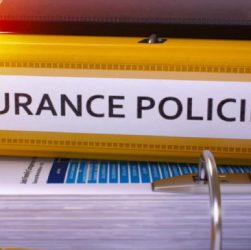 Image Showing An Insurance Policy Book Placed On A Table.