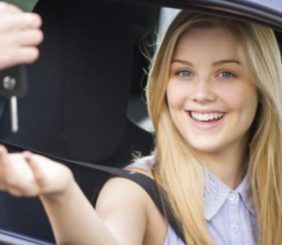 Young Attractive Smiling Woman bought a key.