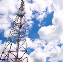 Telecommunication towers against a blue sky