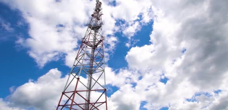 Telecommunication towers against a blue sky