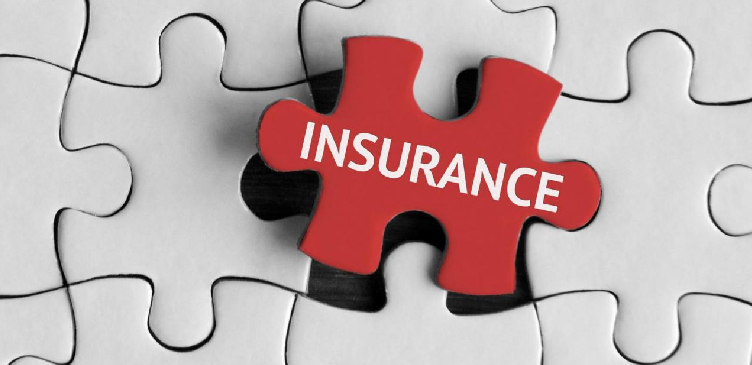 A jigsaw puzzle with the insurance word piece in the centre in red